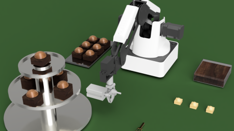 Roboter taucht Pralinen in Schokolade und platziert sie auf einer Etagere